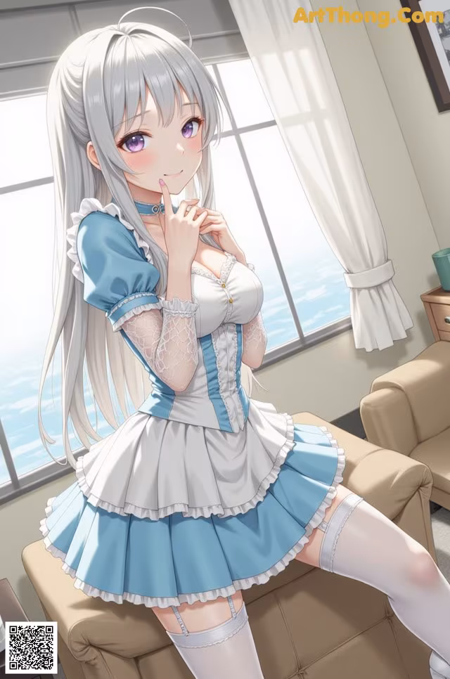 A woman in a blue and white dress sitting on a couch.