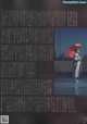 A woman holding an umbrella standing in the rain.