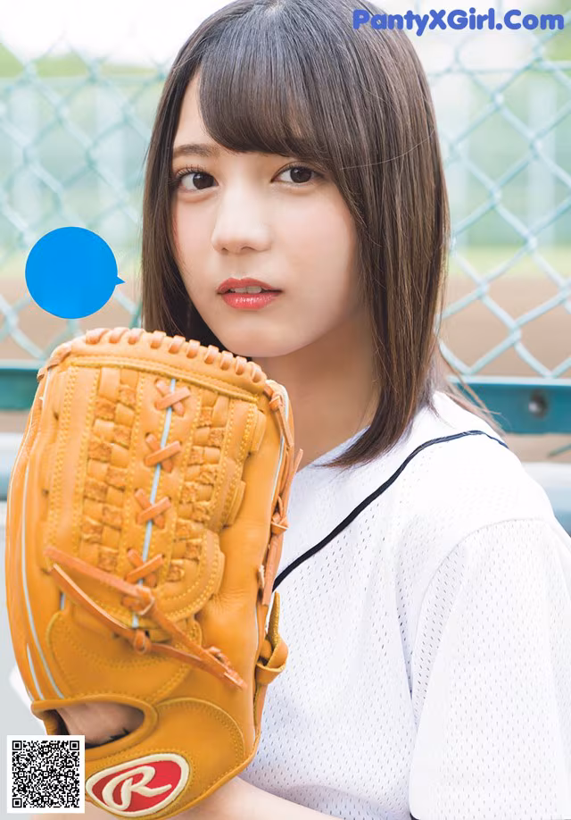 A woman in a baseball uniform holding a baseball glove.