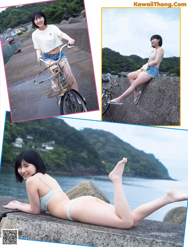 A woman in a bikini sitting on a wall next to a bike.